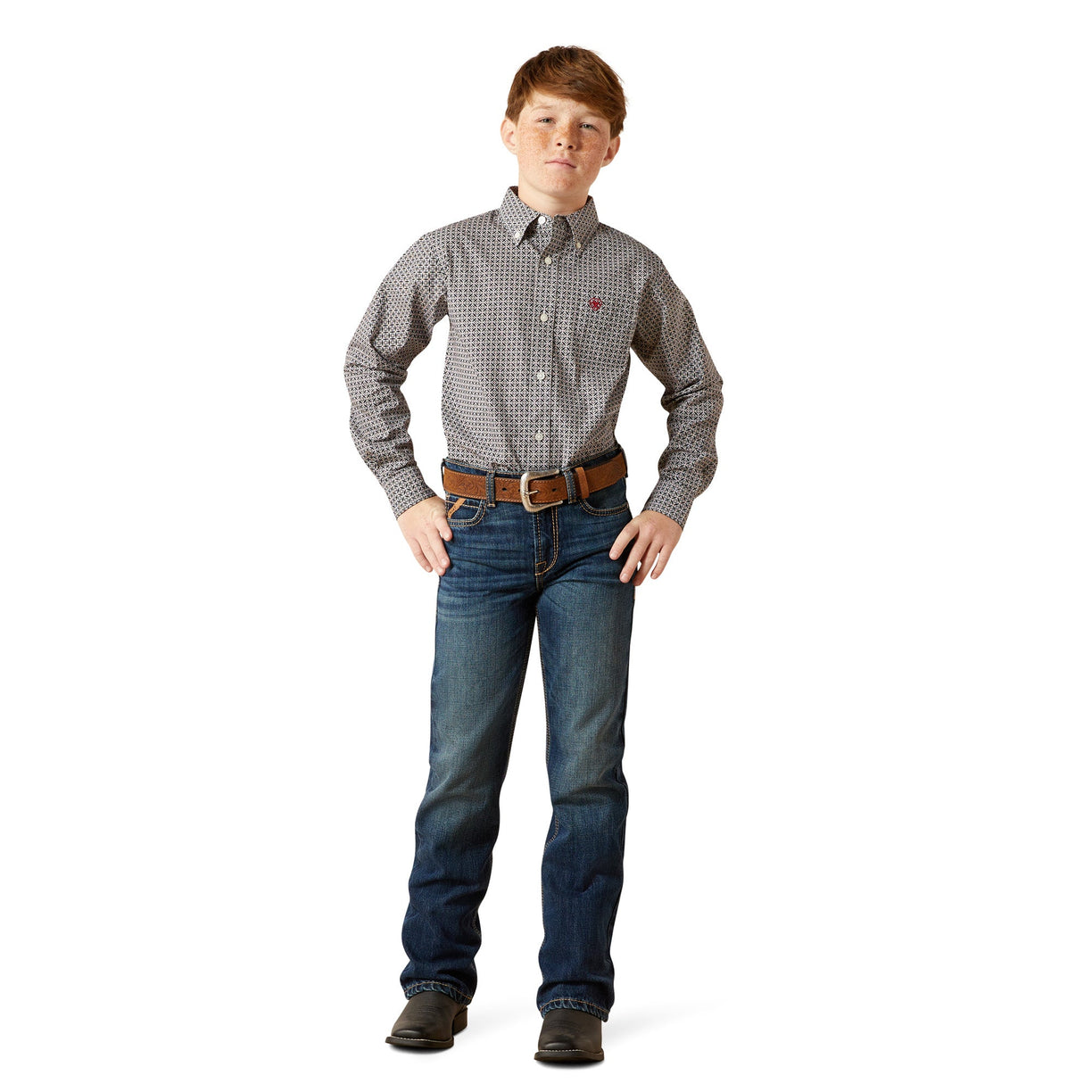 Young boy wearing a patterned shirt and jeans on a white background