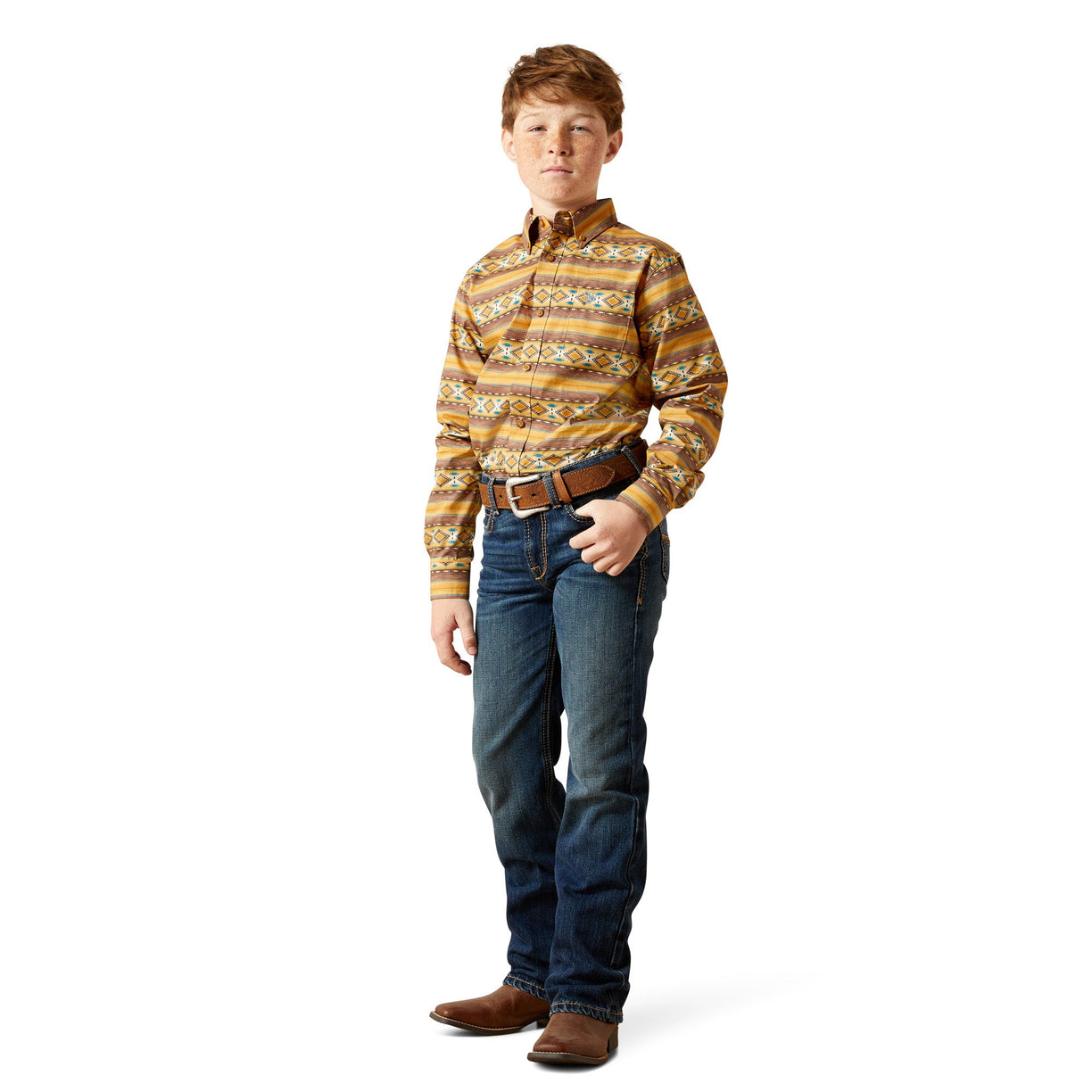 Young boy wearing a patterned shirt and jeans on a white background