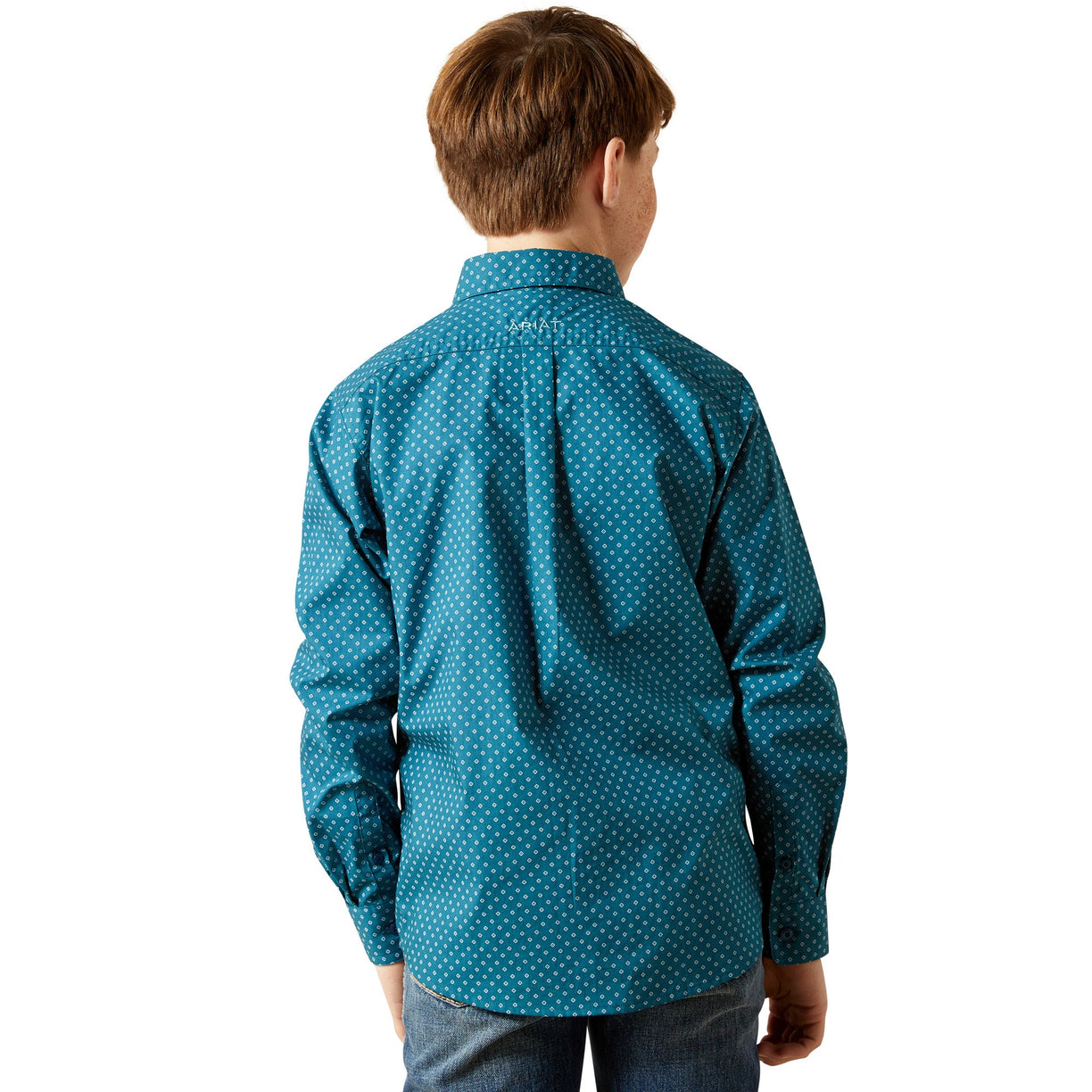 Child wearing a blue patterned shirt on a white background