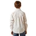 Person wearing a white patterned shirt on a white background