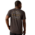 Man wearing a brown Ariat t-shirt with branding on the back against a white background