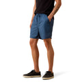 A person wearing blue drawstring shorts, a black t-shirt, and black sneakers, shown from the waist down against a plain white background.