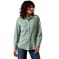 Woman wearing a green striped shirt on a white background