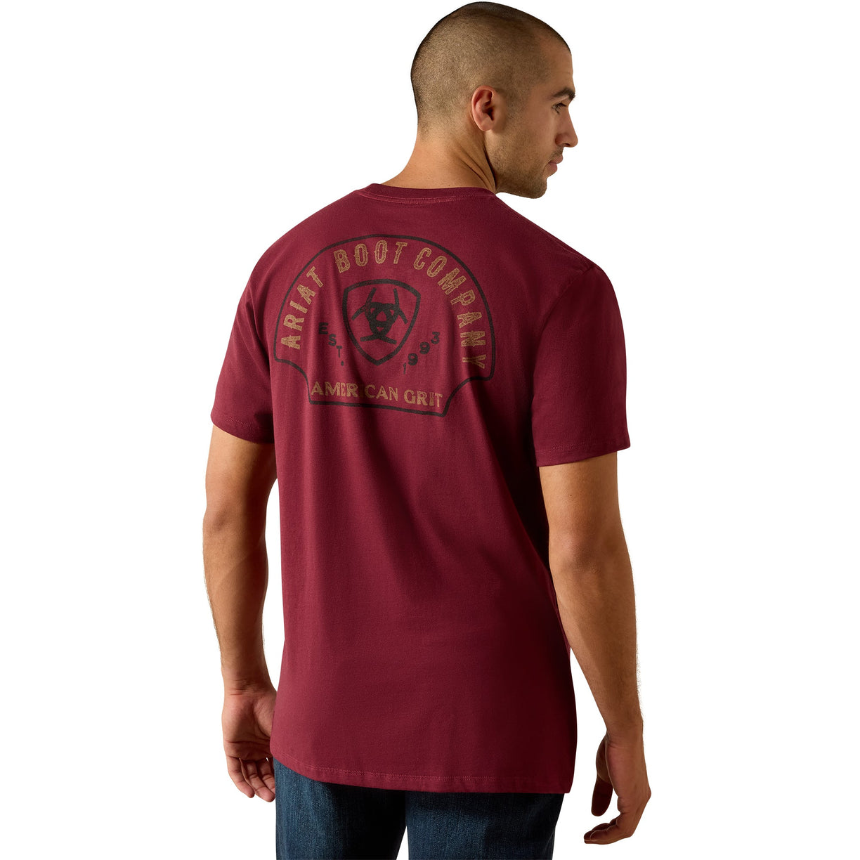 Man wearing a maroon t-shirt with a logo on the back against a white background