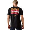 Man wearing a black Ariat t-shirt with a graphic design on the back, standing against a white background.