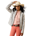A young girl modeling a light gray western-style jacket with a subtle pattern, paired with a pink button-down shirt, coral pants, a brown belt, and a beige cowboy hat against a white background.