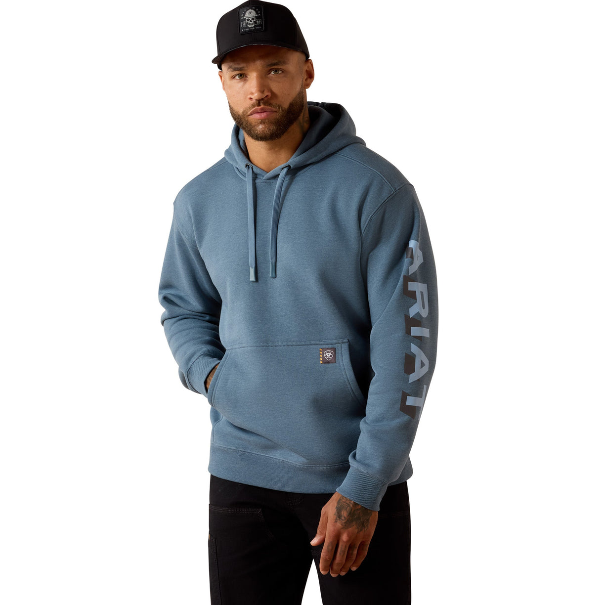 Man wearing a blue hoodie with branding on a white background