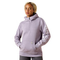 Person wearing a light purple hoodie with a brand logo on a white background