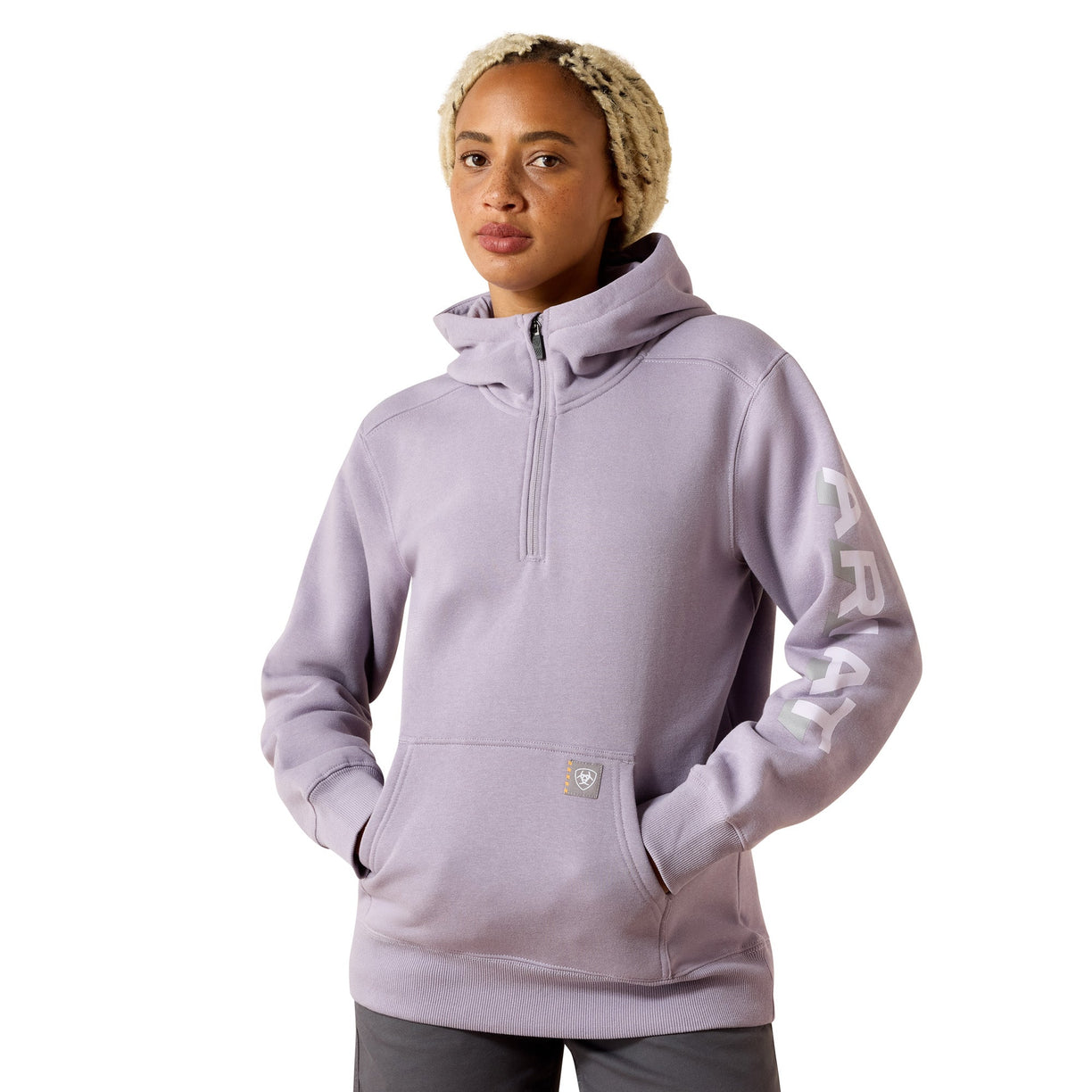 Person wearing a light purple hoodie with a brand logo on a white background