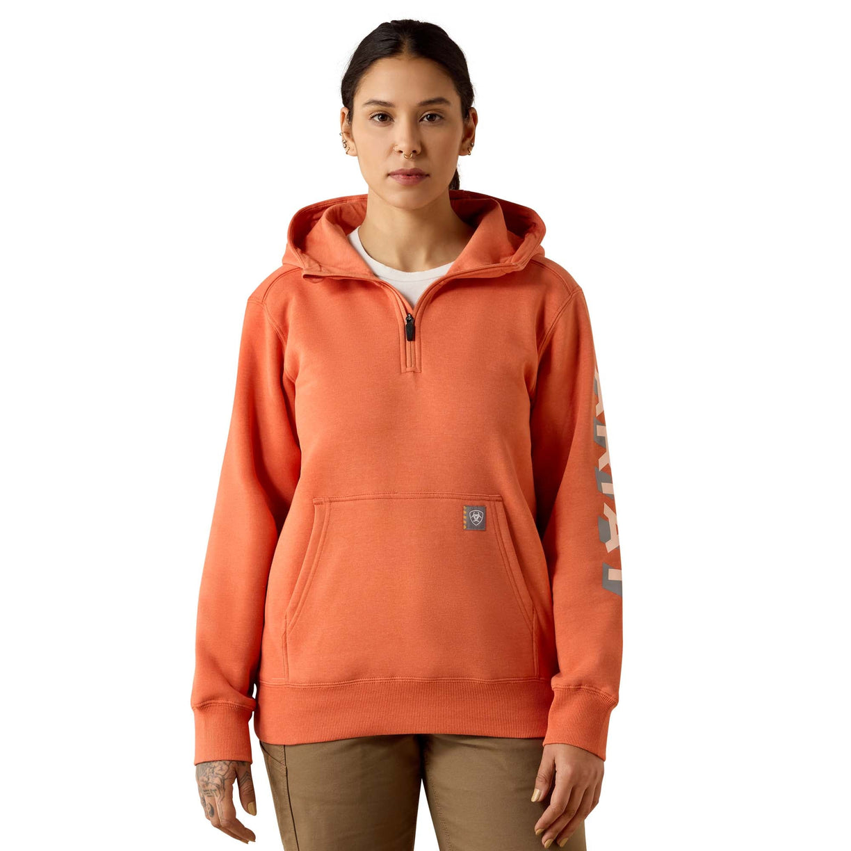 Person wearing an orange hoodie with a white background