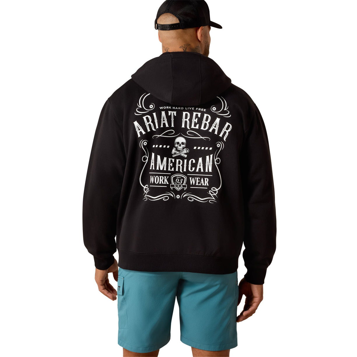 Person wearing a black hoodie with 'Ariat Rebar American Work Wear' text on the back, standing against a white background.
