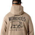 Person wearing a beige hoodie with 'Ariat Workhogs' logo on the back