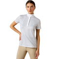 Woman wearing the Ariat Aptos Show Shirt in a white check with zip placket and stand collar, paired with beige jodhpurs