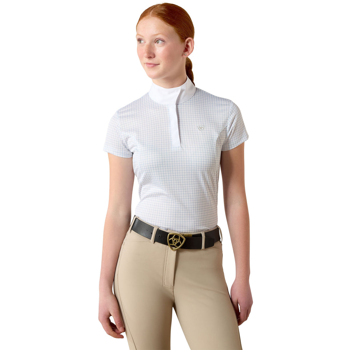 A girl wearing a white checkered equestrian shirt and beige riding pants on a white background
