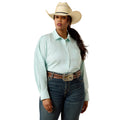 A woman modeling a light mint green and white vertically striped western long-sleeve shirt, paired with dark blue jeans, a brown western belt, and a beige cowboy hat, against a solid white background.