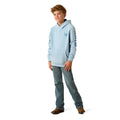 Child wearing a light blue hoodie and jeans on a white background