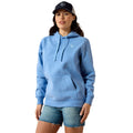 Woman wearing a blue hoodie and denim shorts on a white background
