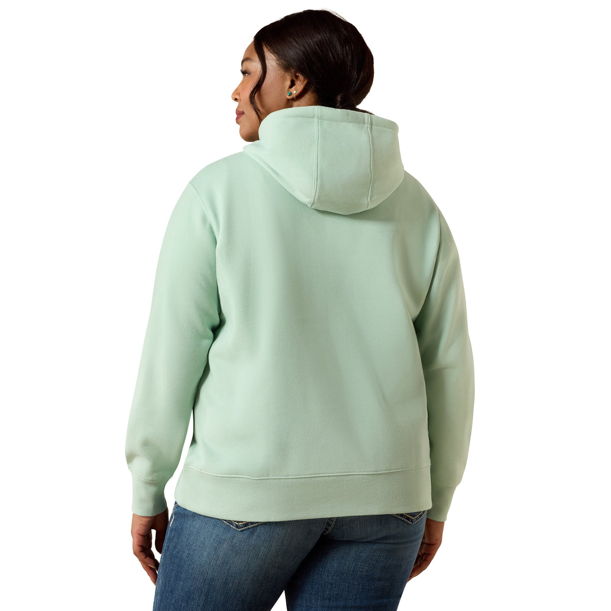 A woman shown from the back wearing a light mint green pullover hoodie and blue jeans against a plain white background.
