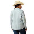 A woman wearing a light blue and white vertically striped long-sleeve button-up shirt, blue jeans, and a beige cowboy hat, shown from a rear three-quarter view against a plain white background.
