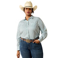 A woman modeling a light blue and white vertically striped long-sleeve western shirt, paired with blue jeans, a brown leather belt, and a cream cowboy hat, against a solid white background.