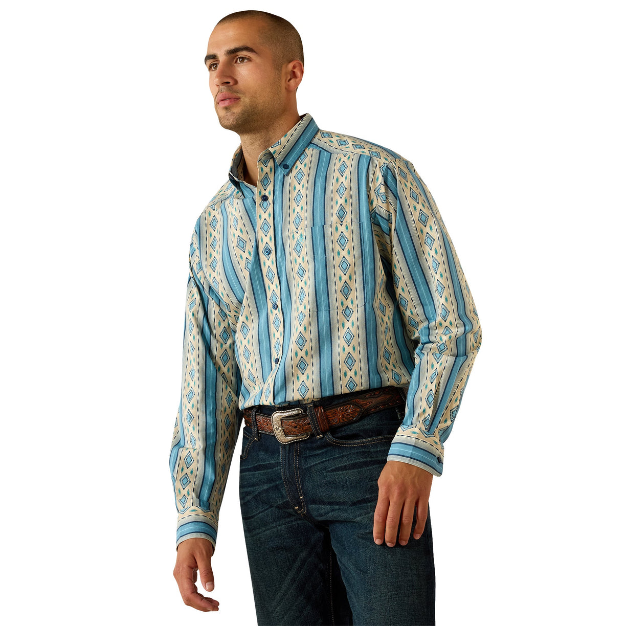 Man wearing a patterned shirt with blue accents on a white background