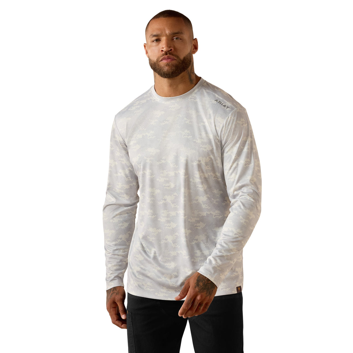 Man wearing the Ariat Rebar Sunblocker Printed Long Sleeve T-Shirt in a light grey tonal camo print