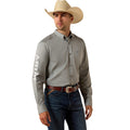 Man wearing a gray Ariat shirt, blue jeans, and a cowboy hat on a white background
