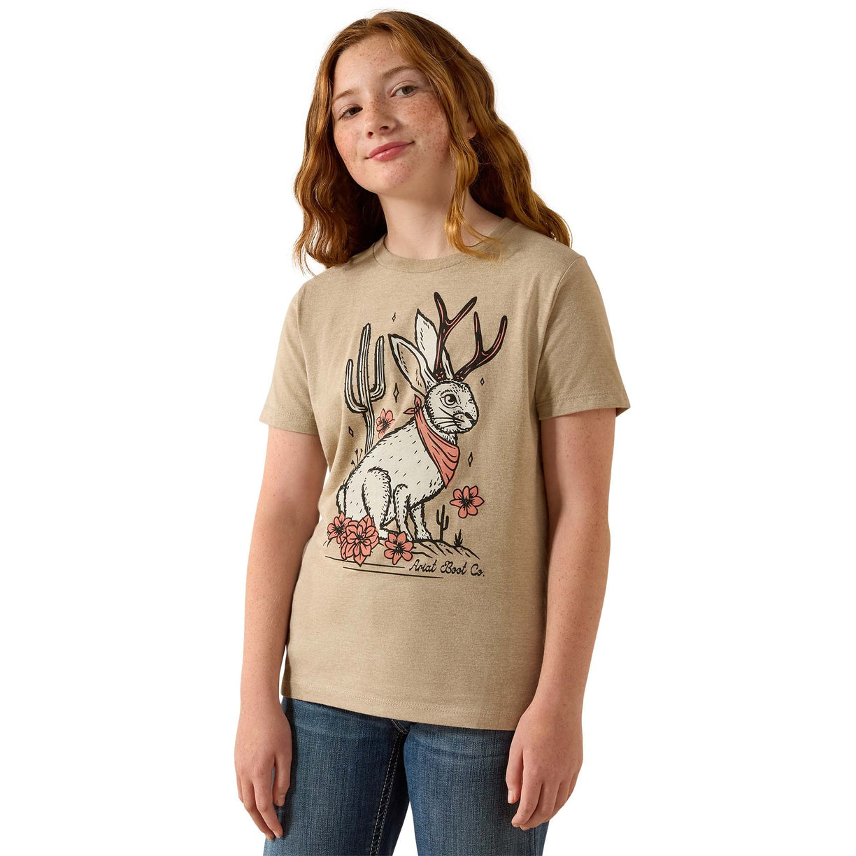 Person wearing a beige t-shirt with a graphic design on a white background