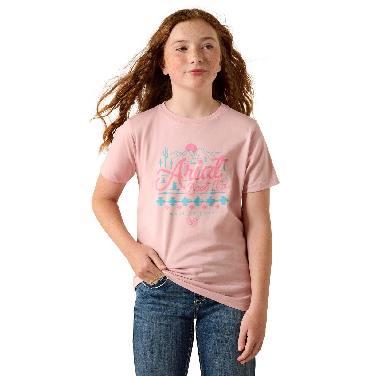 Person wearing a pink t-shirt with text and graphics on a white background