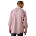 A man viewed from the back wearing a pink and white micro-patterned long-sleeve button-down shirt, paired with blue jeans, against a plain white background.