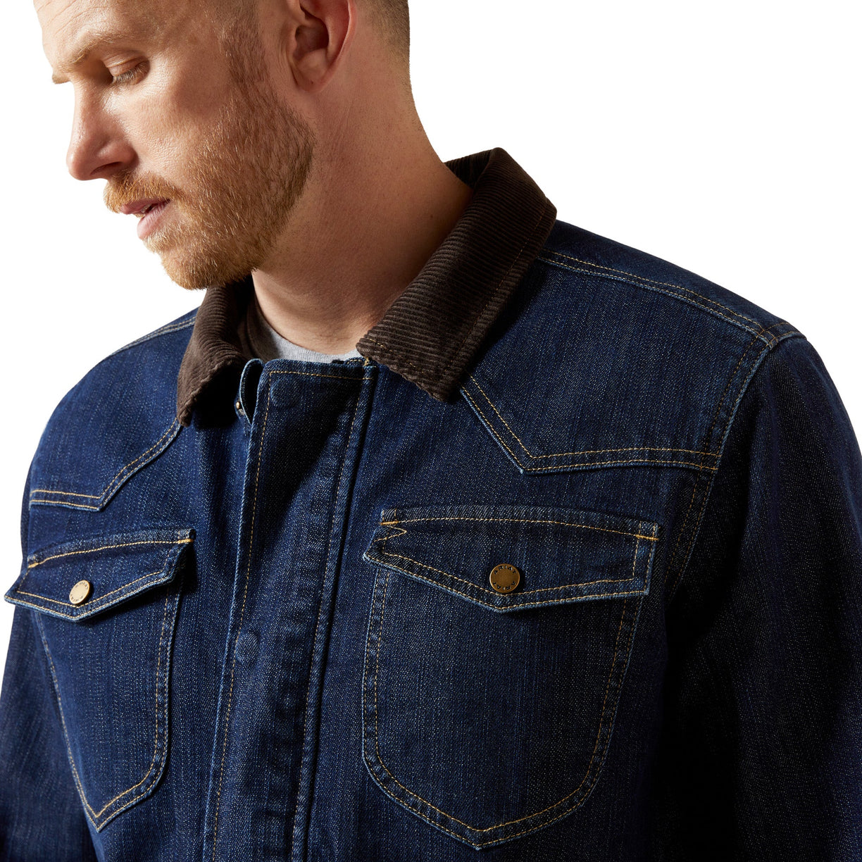 Man wearing a blue denim jacket with a brown collar on a white background