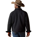 Person wearing a black shirt, blue jeans, and a brown cowboy hat on a white background