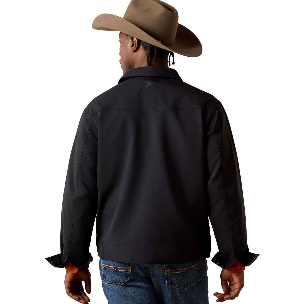 Person wearing a black shirt, blue jeans, and a brown cowboy hat on a white background