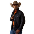 Man wearing a black jacket, orange shirt, and brown cowboy hat on a white background