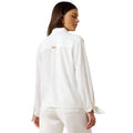 Woman wearing a white shirt and pants on a white background