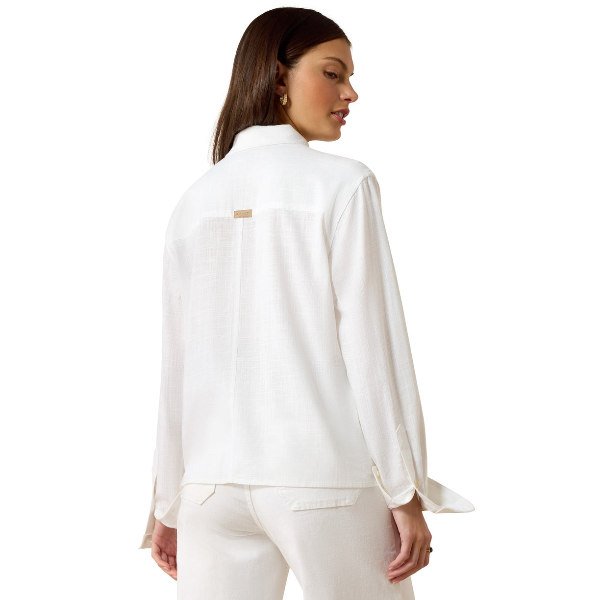 Woman wearing a white shirt and pants on a white background