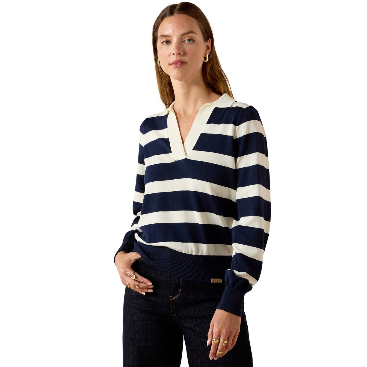 Woman wearing a navy and white striped sweater on a white background