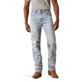 Light blue jeans worn by a person on a white background