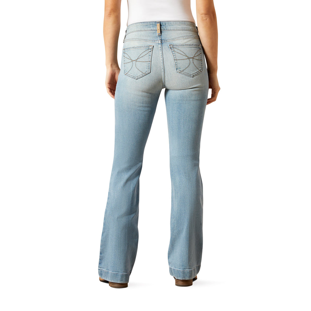 Light blue jeans worn by a person on a white background