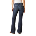 Person wearing blue jeans on a white background