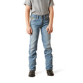 Person wearing light blue jeans on a white background