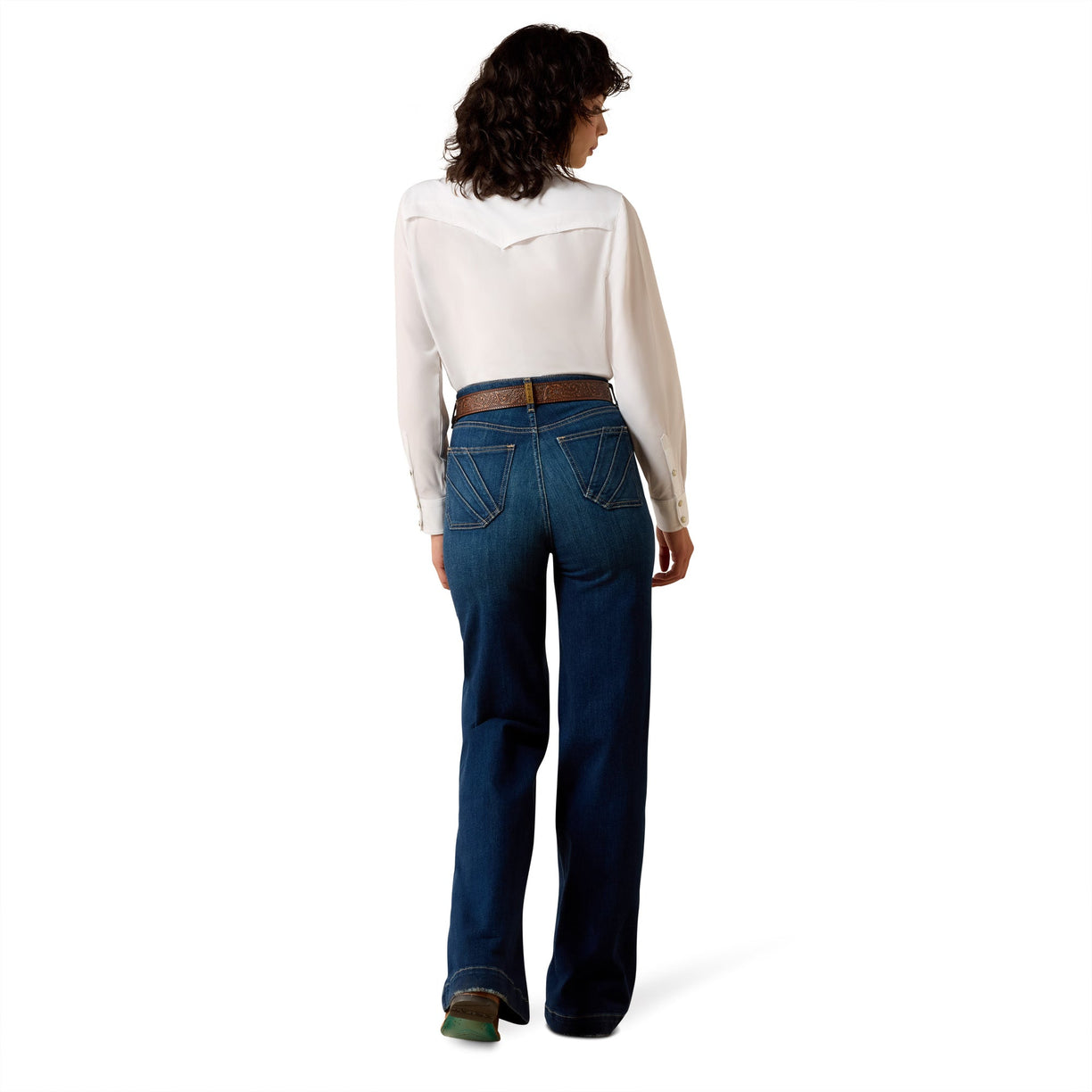 Person wearing blue jeans and a white shirt on a white background