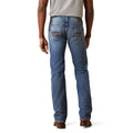 Person wearing blue jeans on a white background