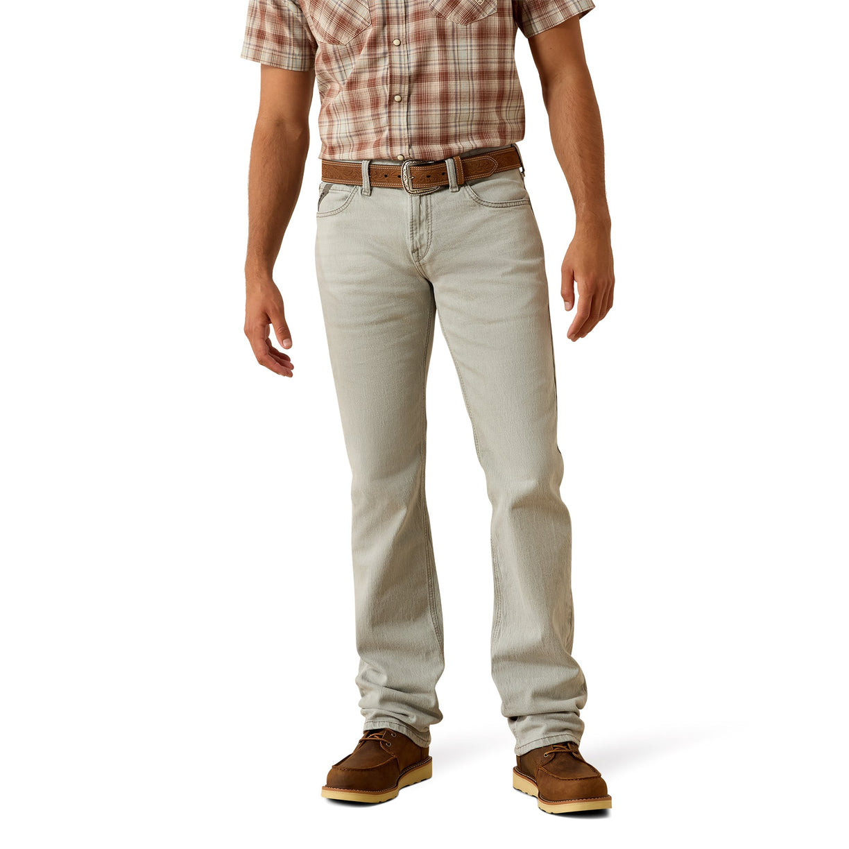 Person wearing light-colored jeans and a plaid shirt on a white background