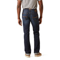 Person wearing dark blue jeans on a white background