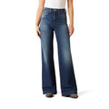 Person wearing blue flared jeans on a white background