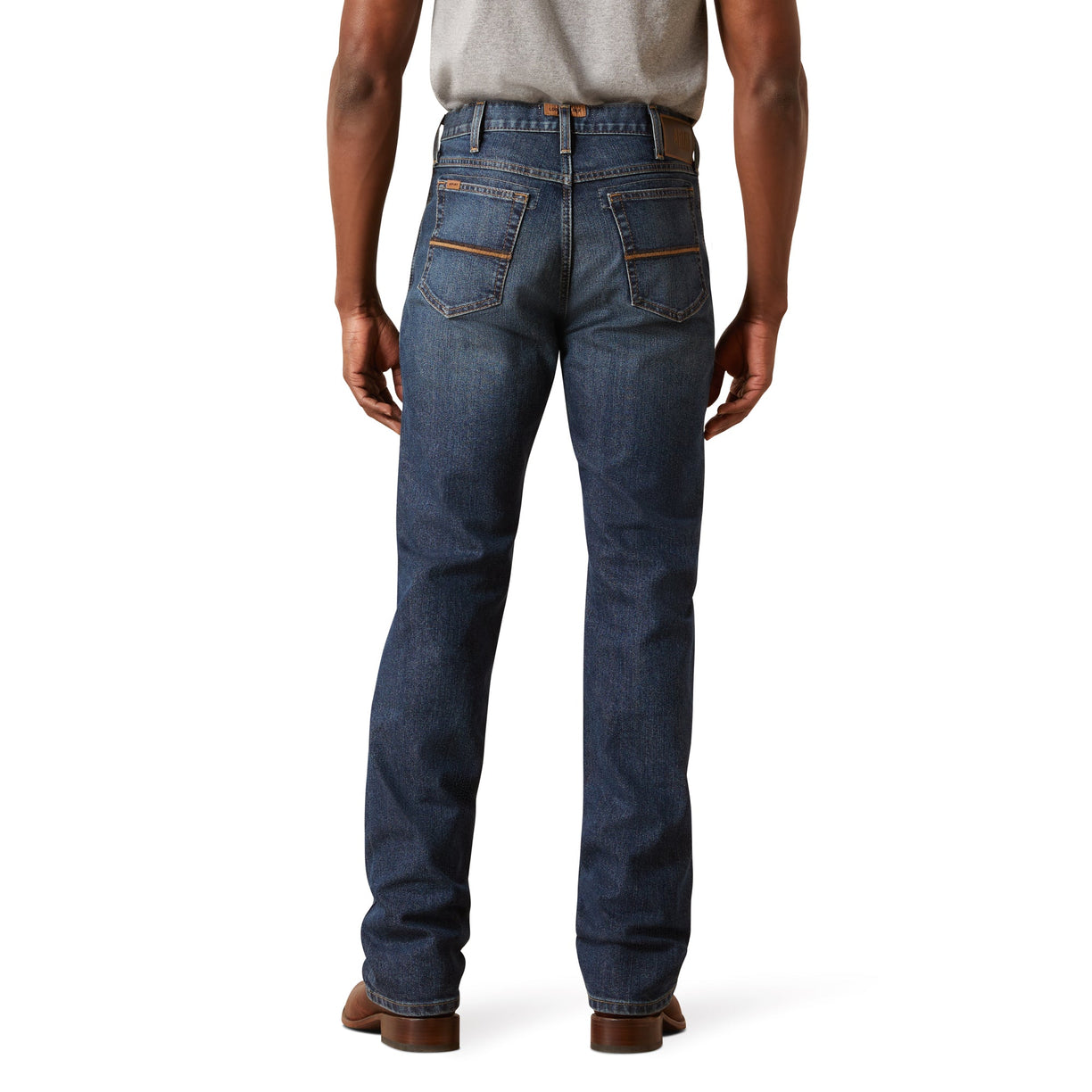Person wearing blue jeans on a white background