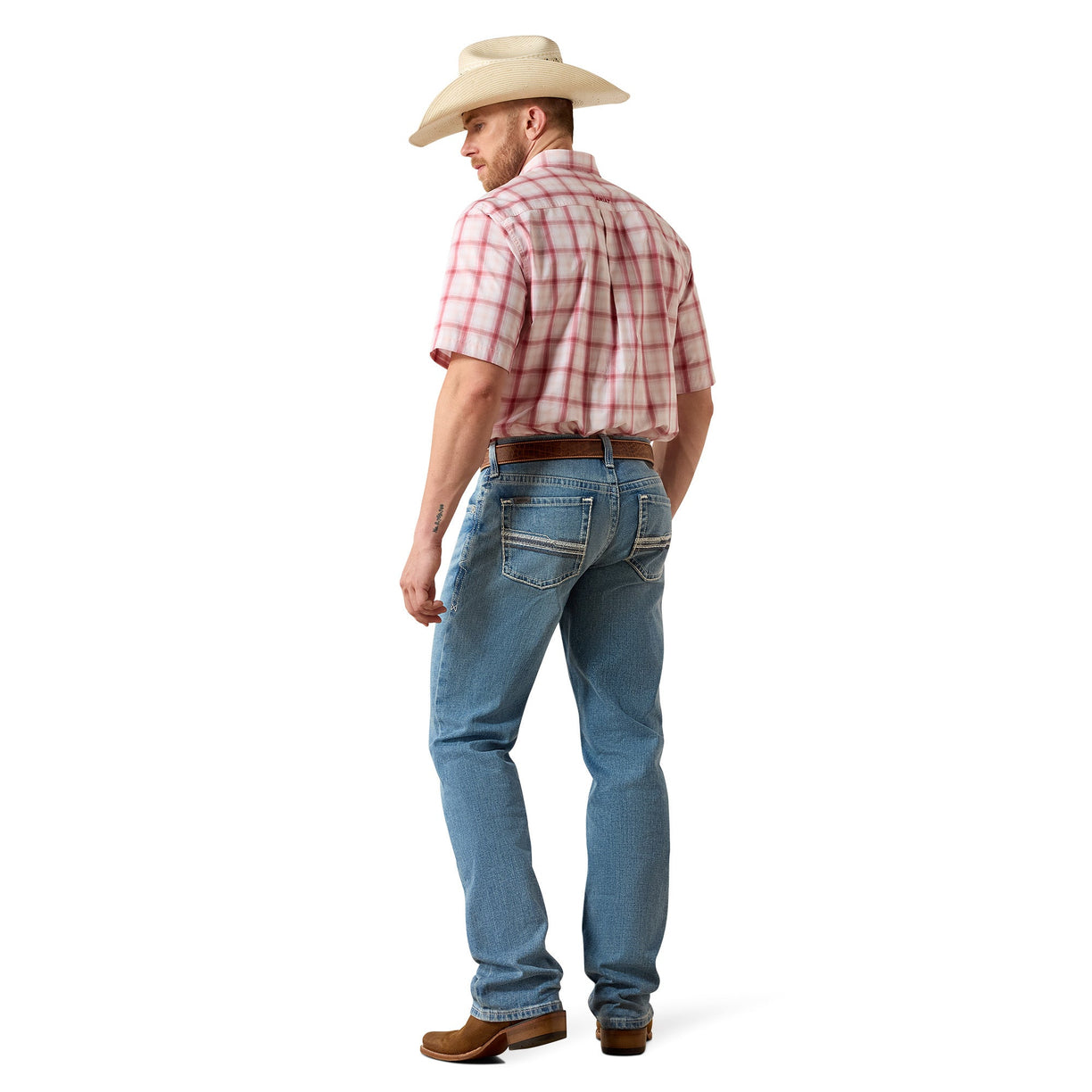 Man wearing a red plaid shirt, blue jeans, and a beige cowboy hat on a white background