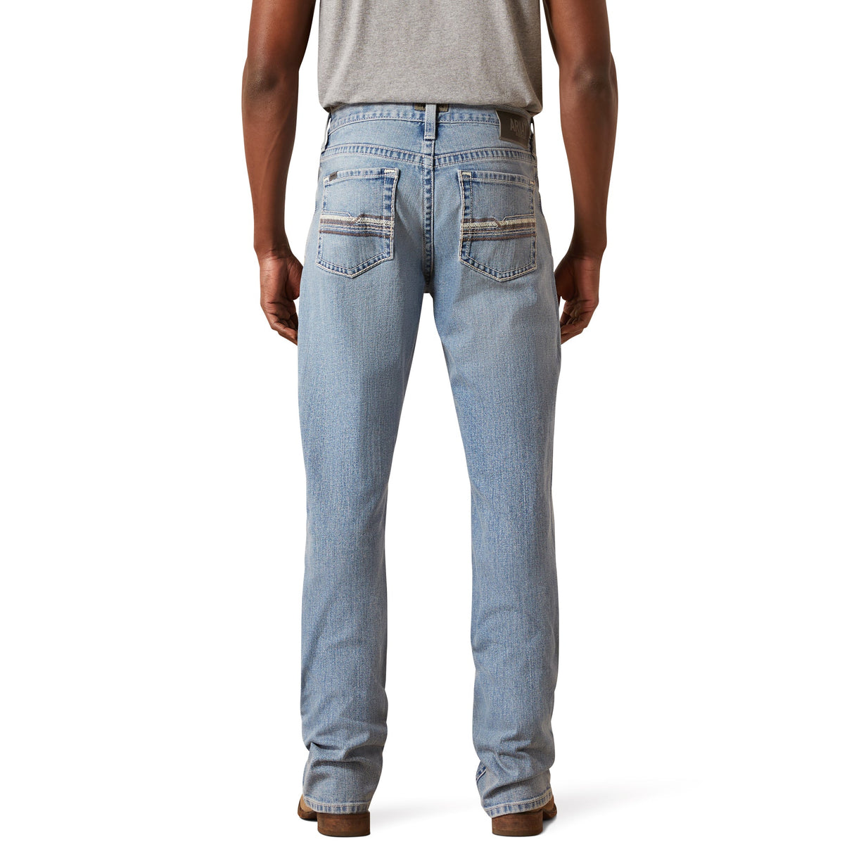 Light blue jeans worn by a person on a white background