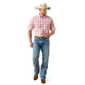 Man wearing a red plaid shirt, blue jeans, and a cowboy hat on a white background
